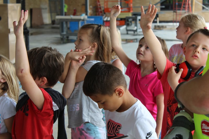 Photo of students touring inside the new school addition