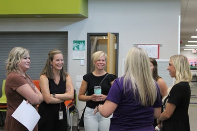 group of people talking and smiling