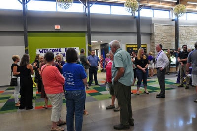 group of people talking and smiling